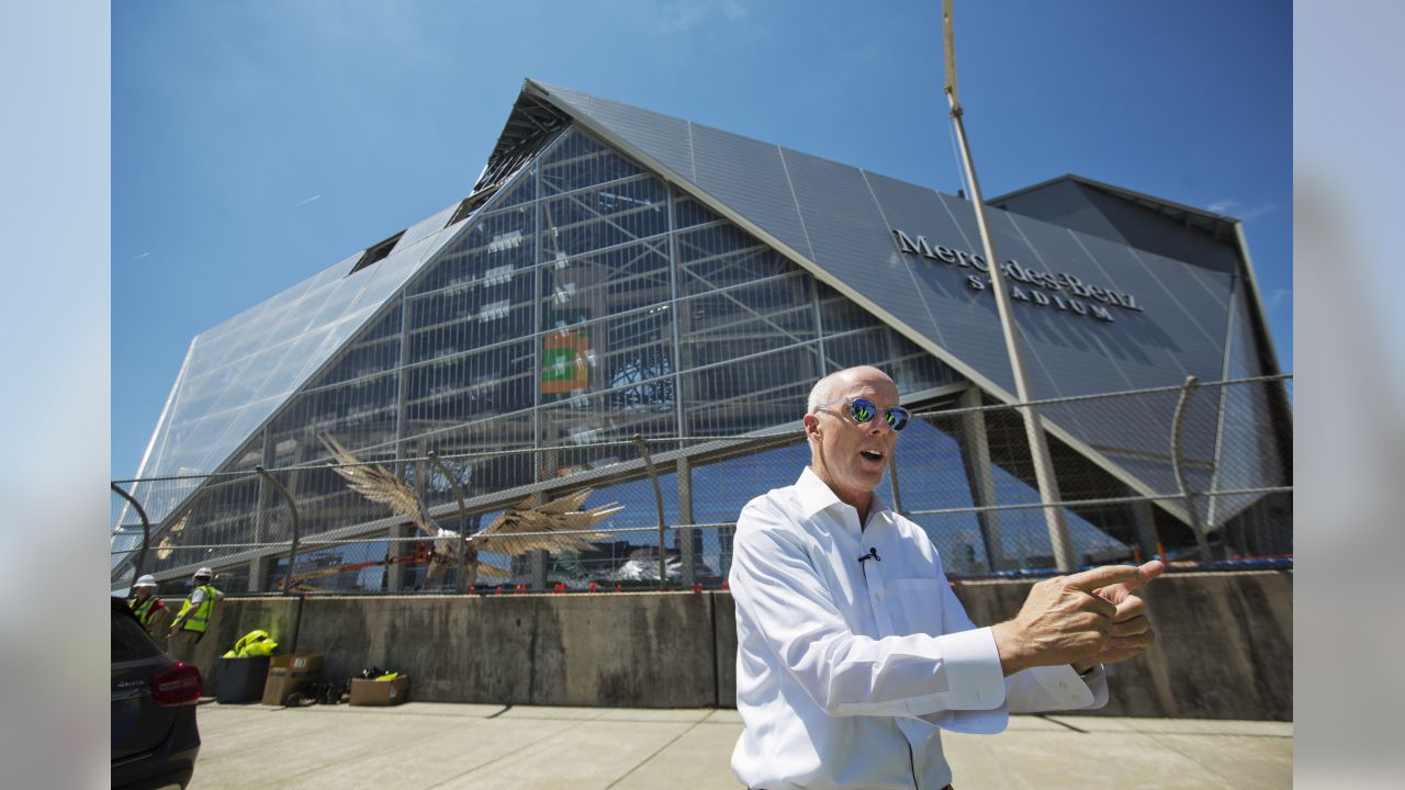 Rapper T.I. looks out from a suite during a tour of Mercedes-Benz Stadium,  the new stadium for the Atlanta Falcons NFL football team under  construction in Atlanta, Tuesday, April 25, 2017. (AP