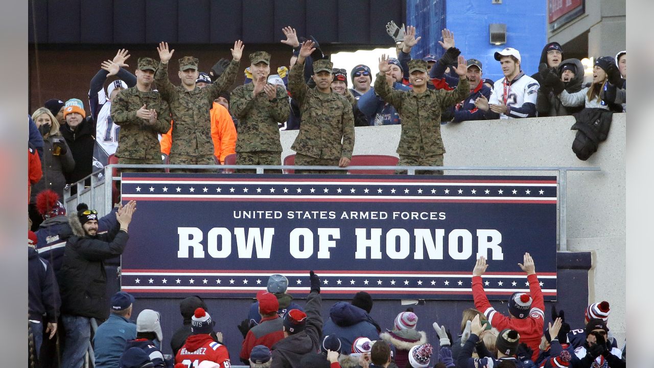 U.S. Military recruits are sworn in during halftime on Salute to Service  military appreciation day at an NFL football game between the Jacksonville  Jaguars and the Las Vegas Raiders, Sunday, Nov. 6