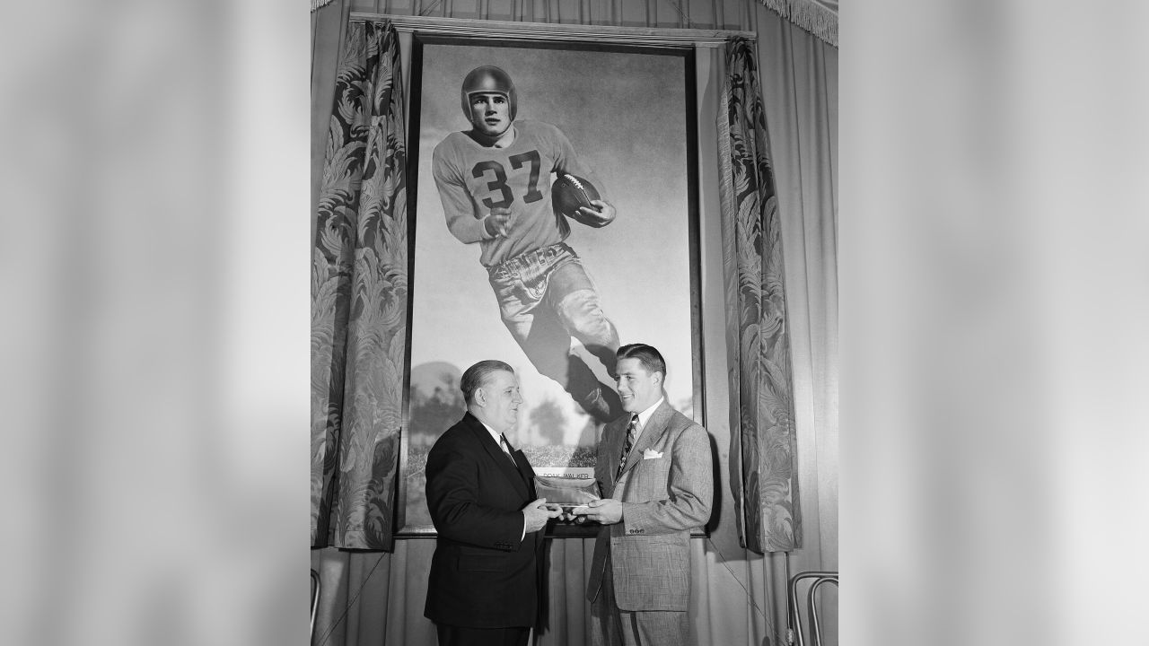 Bert Bell, center, of Philadelphia, receives congratulations in Chicago  Jan. 20, 1949 fronm George Halas Jr., left, and Charles W. Bidwell Jr.  after being presented with a 10-year contract to continue to