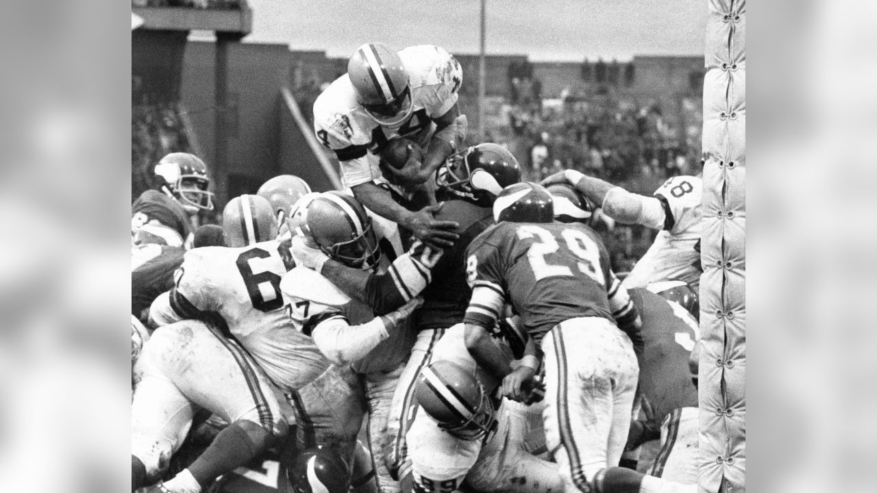 FILE - In this Dec. 31, 1967, file photo, players spill in all directions  as a fumble occurs in the third period of the National Football League  Championship game between the Dallas