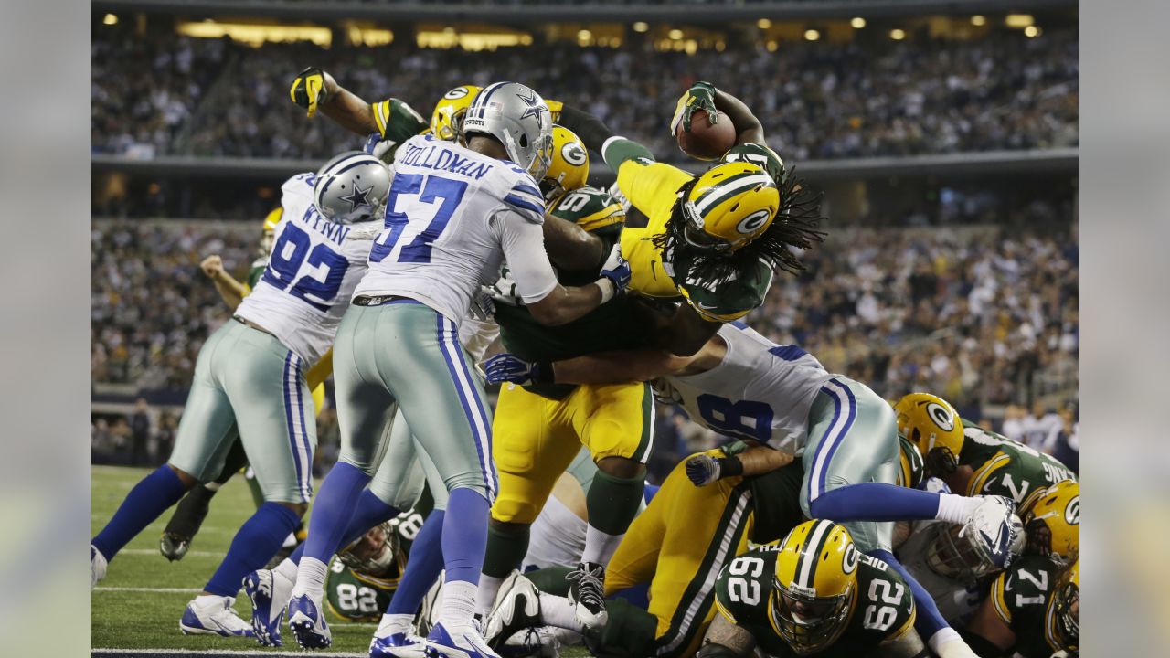 Dallas Cowboys running back DeMarco Murray (29) is tackled by Green Bay  Packers defensive end Josh Boyd (93) during the second half of an NFL  football game Sunday, December 15, 2013 in