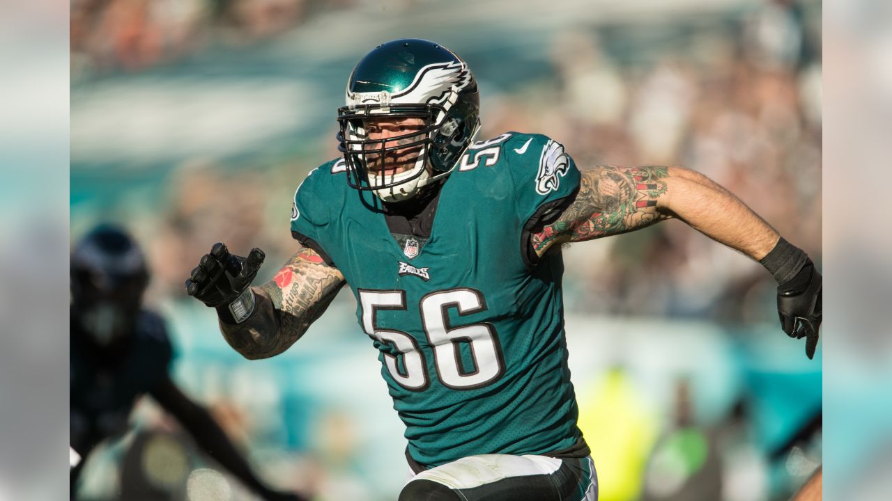 A Super Bowl Champion badge is seen on the chest of Philadelphia Eagles  defensive end Chris Long (56) during the first quarter of an NFL football  game against the Atlanta Falcons at