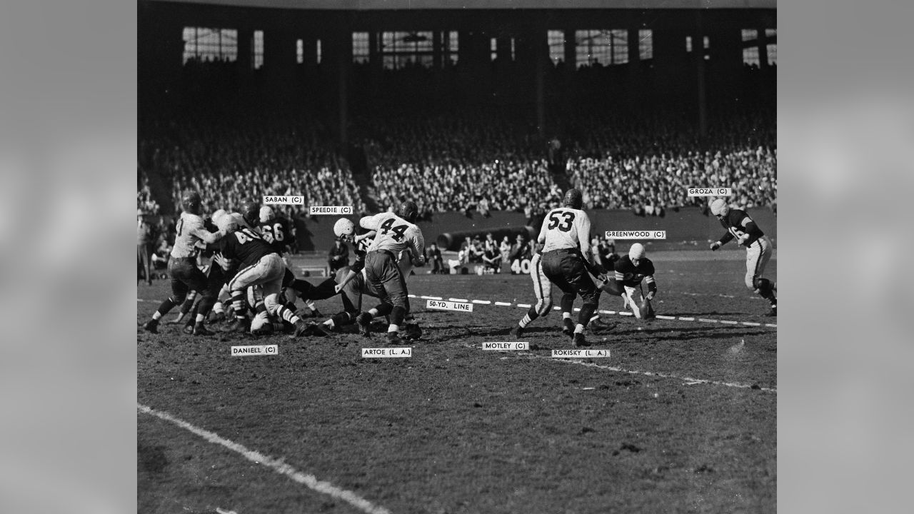 Lou Groza, the Cleveland Browns tackle with the Atomic Toe, is shown  approaching the ball as he exploded a towering field goal to aid in a 31 to  14 defeat of the