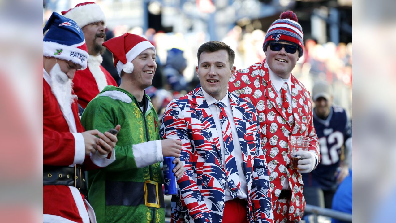 An Arizona Cardinals fan, dressed as Santa Claus, cheers during the first  half of an NFL football game against the Indianapolis Colts, Saturday, Dec.  25, 2021, in Glendale, Ariz. (AP Photo/Rick Scuteri