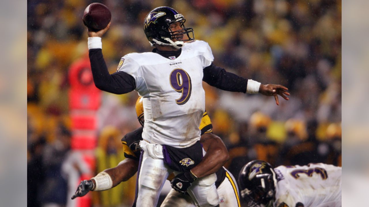 Steve McNair #9 of the Baltimore Ravens is sacked and fumbles