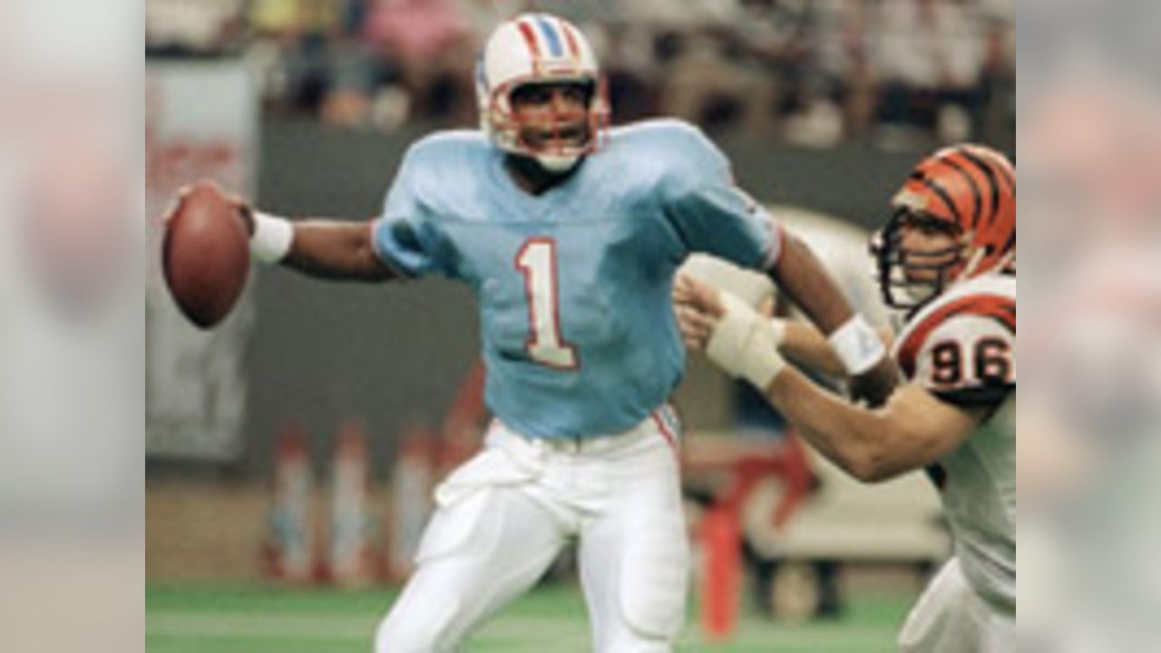 Former NFL great Warren Moon poses with his bust after