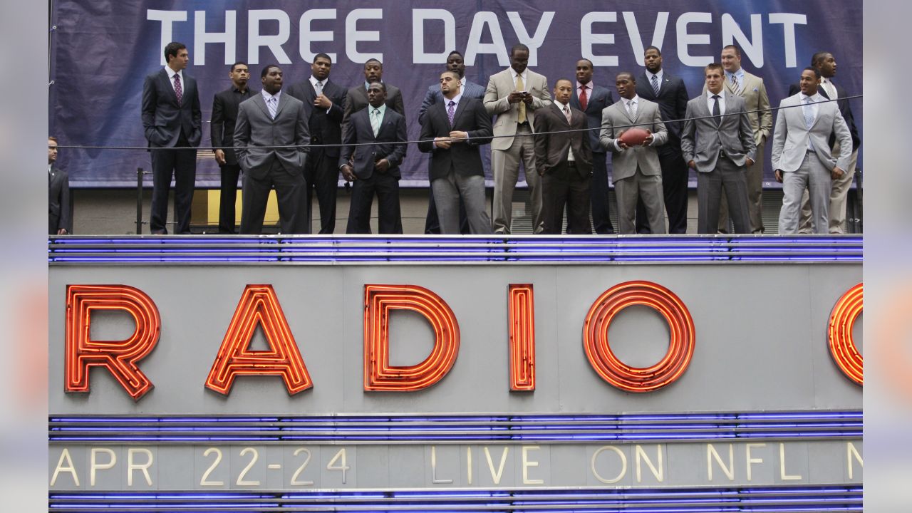 NFL draft prospects pose for photographs on the marquis of Radio