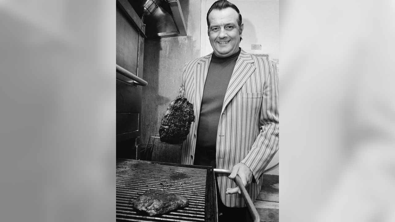 Baltimore Colt Gino Marchetti working in the kitchen of his Gino's  Hamburgers restaurant in Baltimore, MD on 11/10/1964. Gino's would have 359  company-owned locations when Marriott Corporation acquired it in 1982.  Marriott