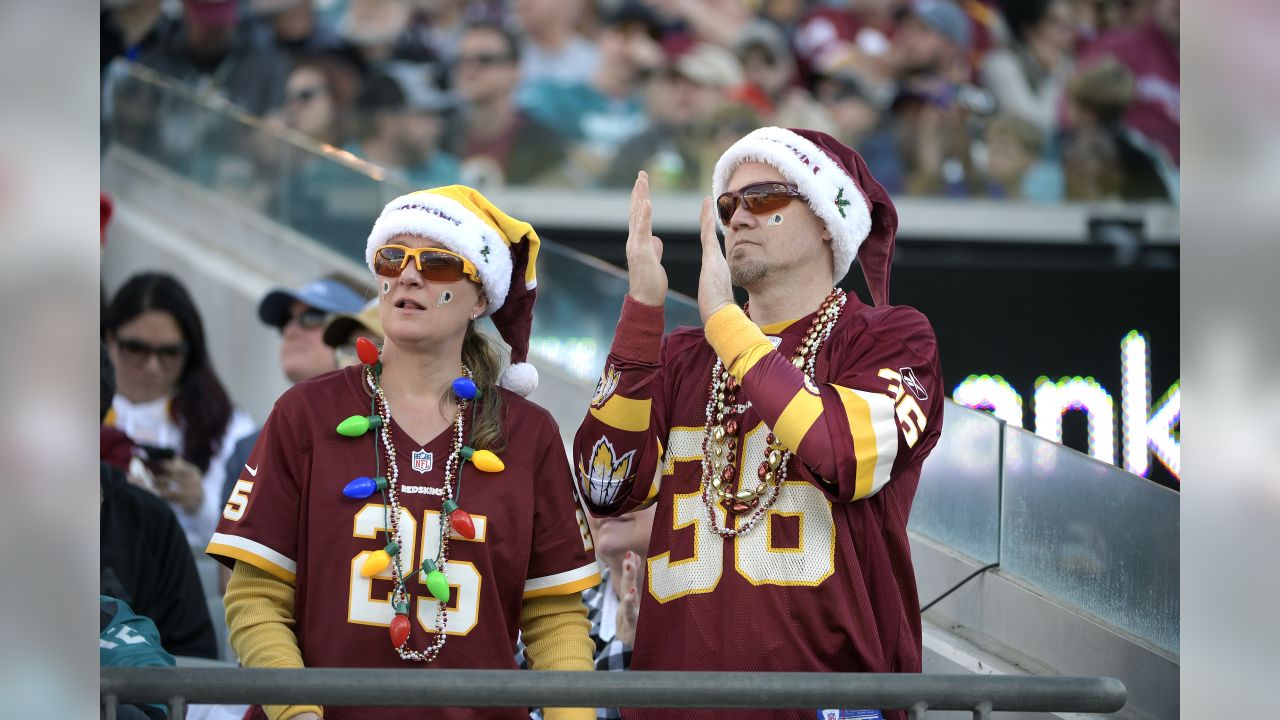 Fans cheer before an NFL football game between the Los Angeles