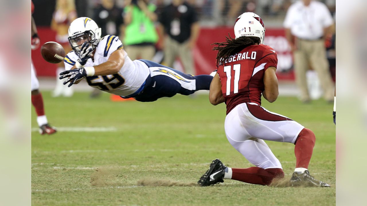 San Diego Chargers' Quentin Jammer intercepts a pass intended for Seattle  Seahawks' Mike Williams (17) as Chargers' Eric Weddle looks on in the first  half of an NFL football game, Sunday, Sept.