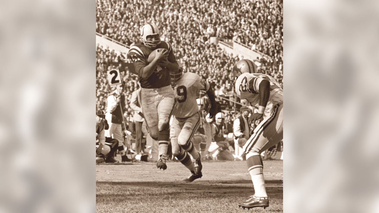 FILE - In this Oct. 7, 1962, file photo, Green Bay Packers halfback Paul  Hornung (5) carries the Detroit Lions, including Roger Brown (76, to the  right of Hornung), during the second