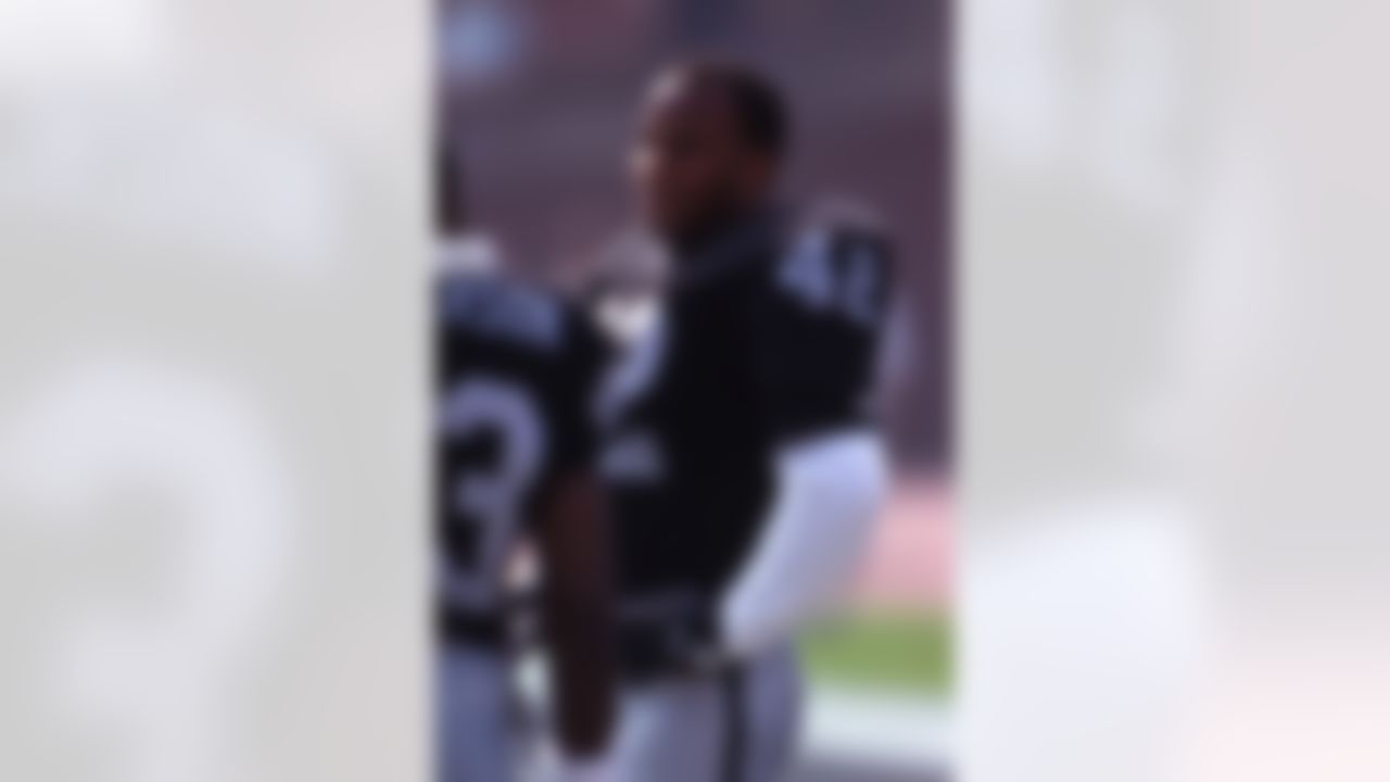 Los Angeles Raiders Ronnie Lott takes a break on the sideline in a game verse the Denver Broncos on Sunday September 8, 1991 in Los Angeles. (AP Photo/Kevin Reece)