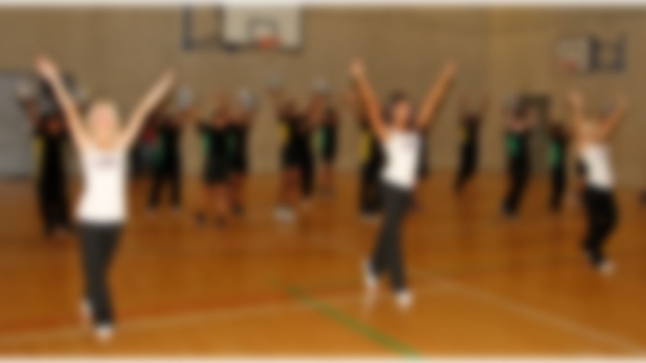Atlanta Falcons cheerleaders work with students on a dance routine at a local school on Thursday, Oct. 23, 2014 in Brixton, South London. (Nicky Hayes/NFL)