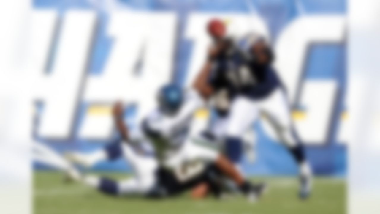August 11, 2011; San Diego, CA, USA; Seattle Seahawks quarterback Tavaris Jackson (7) is sacked by San Diego Chargers defensive end Luis Castillo (93) and pressured by Jacques Cesaire (74) during the first quarter at Qualcomm Stadium. Mandatory Credit: Christopher Hanewinckel-US PRESSWIRE