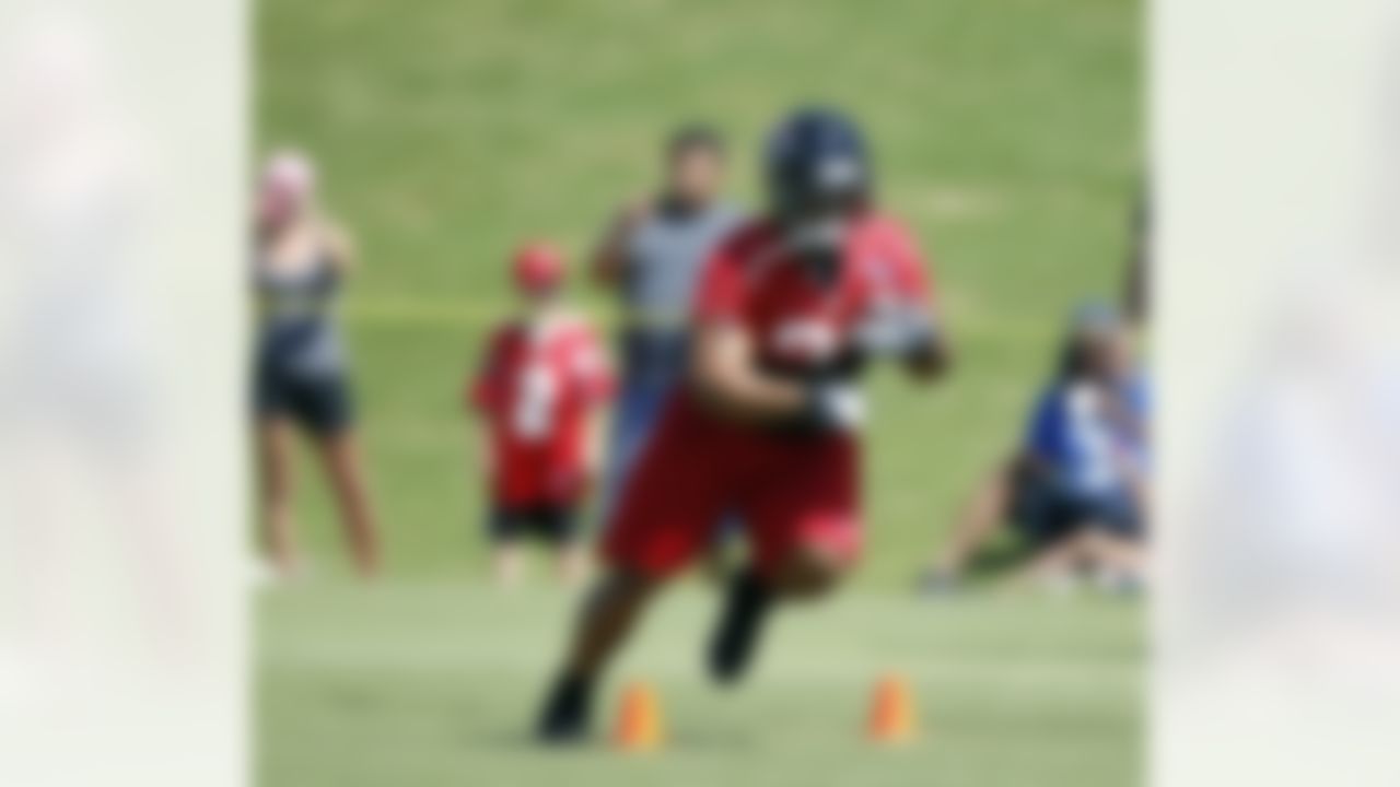Atlanta Falcons running back Michael Turner runs a drill during football training camp in Flowery Branch, Ga., Friday, July 27, 2012. (AP Photo/John Bazemore)