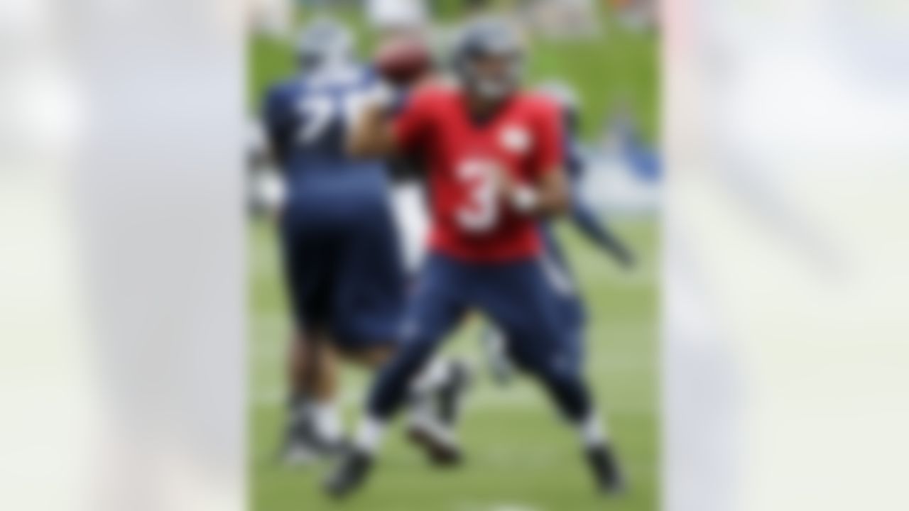 Seattle Seahawks quarterback Russell Wilson looks to pass during NFL football training camp, Monday, July 30, 2012, in Renton, Wash. (AP Photo/Ted S. Warren)