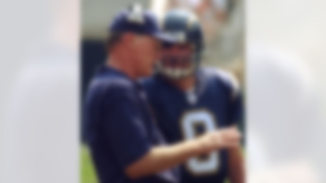 San Diego Chargers head coach Marty Schottenheimer talks with quarterback Drew Brees (9) in the first half Sunday, Sept. 8, 2002, in Cincinnati. (AP Photo/Al Behrman)