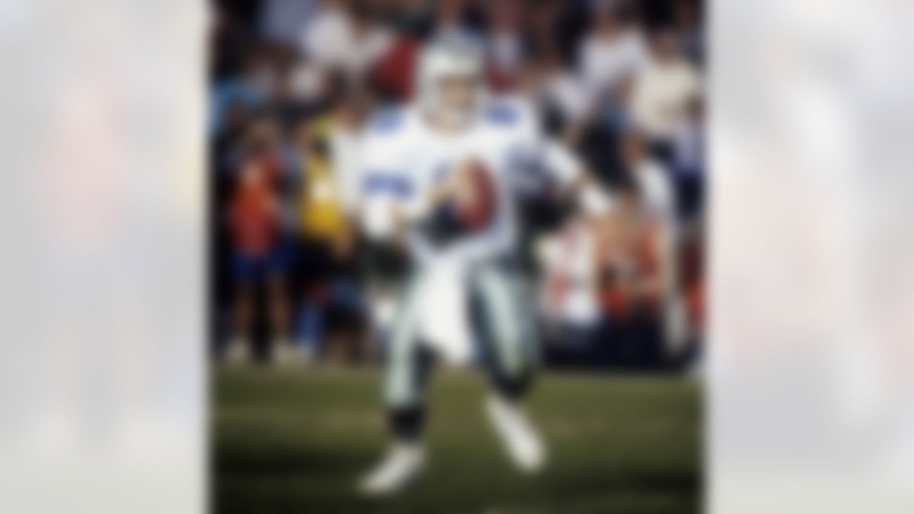 Dallas Cowboys Hall of Fame quarterback Troy Aikman (8) scrambles from the pocket during Super Bowl XXVII, a 52-17 victory over the Buffalo Bills on January 31, 1993, at the Rose Bowl in Pasadena, California. (National Football League)