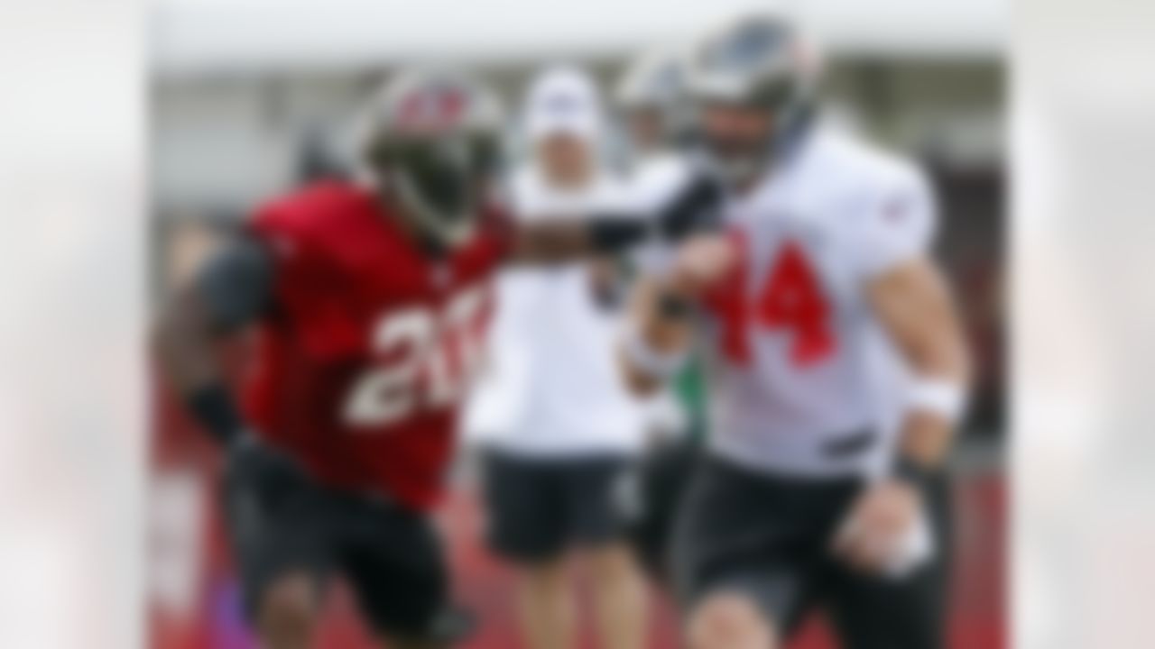 Tampa Bay Buccaneers' Ronde Barber, left, defends against tight end Dallas Clark during a workout at NFL football training camp, Saturday, July 28, 2012, in Tampa, Fla. (AP Photo/Mike Carlson)