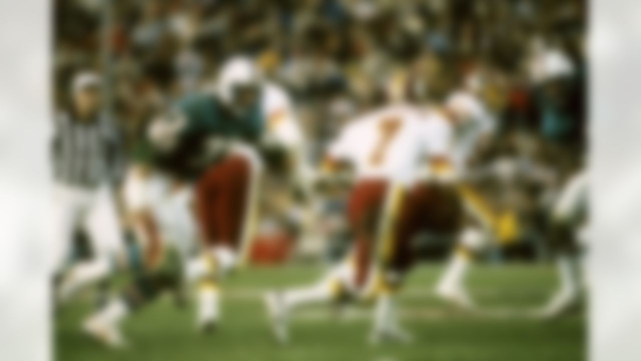 Miami Dolphins nose tackle Bob Baumhower moves in to sack Washington Redskins quarterback Joe Theismann during the Super Bowl XVII on January 30, 1983 at the Rose Bowl in Pasadena, CA. (AP Photo/Al Messerschmidt)
