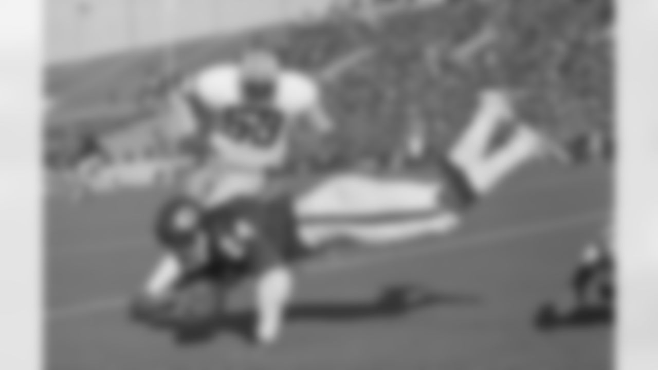 Green Bay Packers running back John Brockington (42) turns to watch the ball that was jarred out of his arms after he was tackled in the end zone by Chicago Bears cornerback Joe Taylor (20), in the second quarter, Sunday, Nov. 7, 1971, Chicago, Ill. Officials ruled he held it long enough for a touchdown. (AP Photo/Fred Jewell)