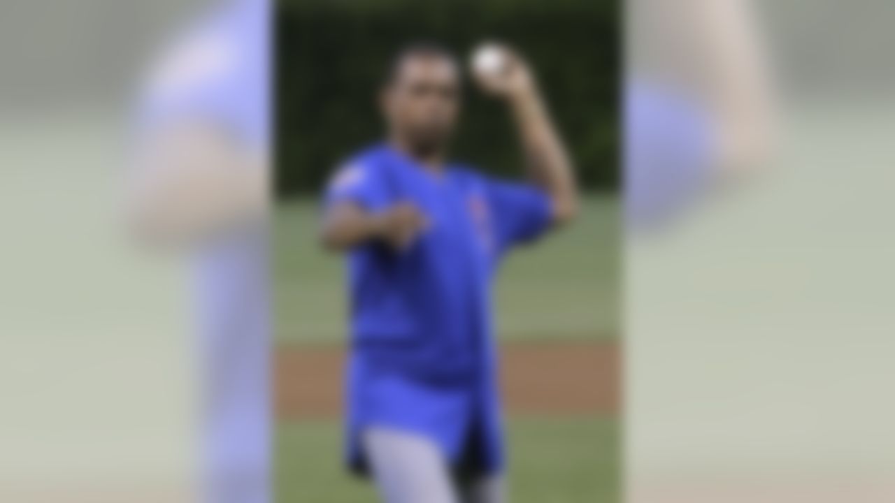 Former Chicago Bears running back Gale Sayers throws out a ceremonial first pitch before a baseball game between the Houston Astros and the Chicago Cubs on Wednesday, Sept. 8, 2010, at Wrigley Field in Chicago. (AP Photo/Charles Rex Arbogast)