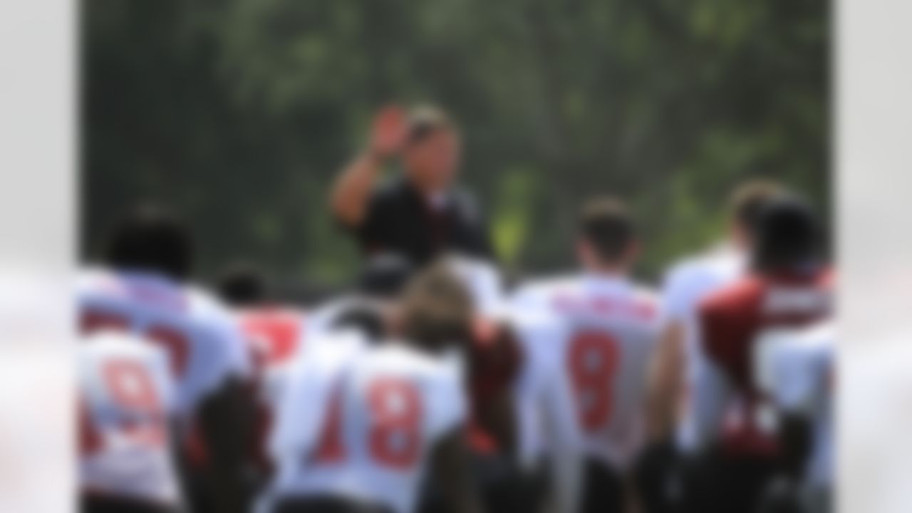 Tampa Bay Buccaneers head coach Greg Schiano, center, addresses his players following a workout during NFL football training camp, Friday, July 27, 2012, in Tampa, Fla. (AP Photo/Brian Blanco)