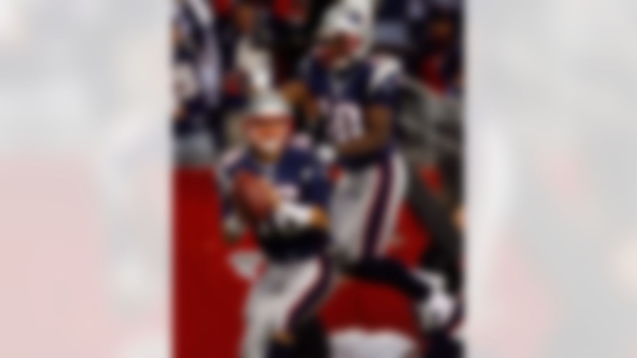 FOXBORO, MA - OCTOBER 28: Matt Cassel #16 of the New England Patriots is congratulated by Donte Stallworth #18 after Cassel ran the ball in for a touchdown in the fourth quarter against the Washington Redskins on October 28, 2007 at Gillette Stadium in Foxboro, Massachusetts. The Patriots defeated the Redskins 52-7. (Photo by Jim Rogash/Getty Images)