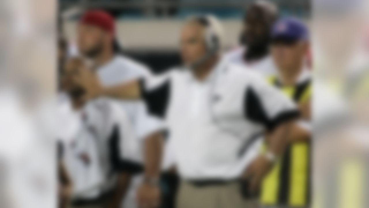 Atlanta Falcons first-year head coach Mike Smith, foreground, works the sidelines during a National Football League preseason football game against the Jacksonville Jaguars, Saturday, Aug. 9, 2008, in Jacksonville, Fla. (AP Photo/Phil Coale)