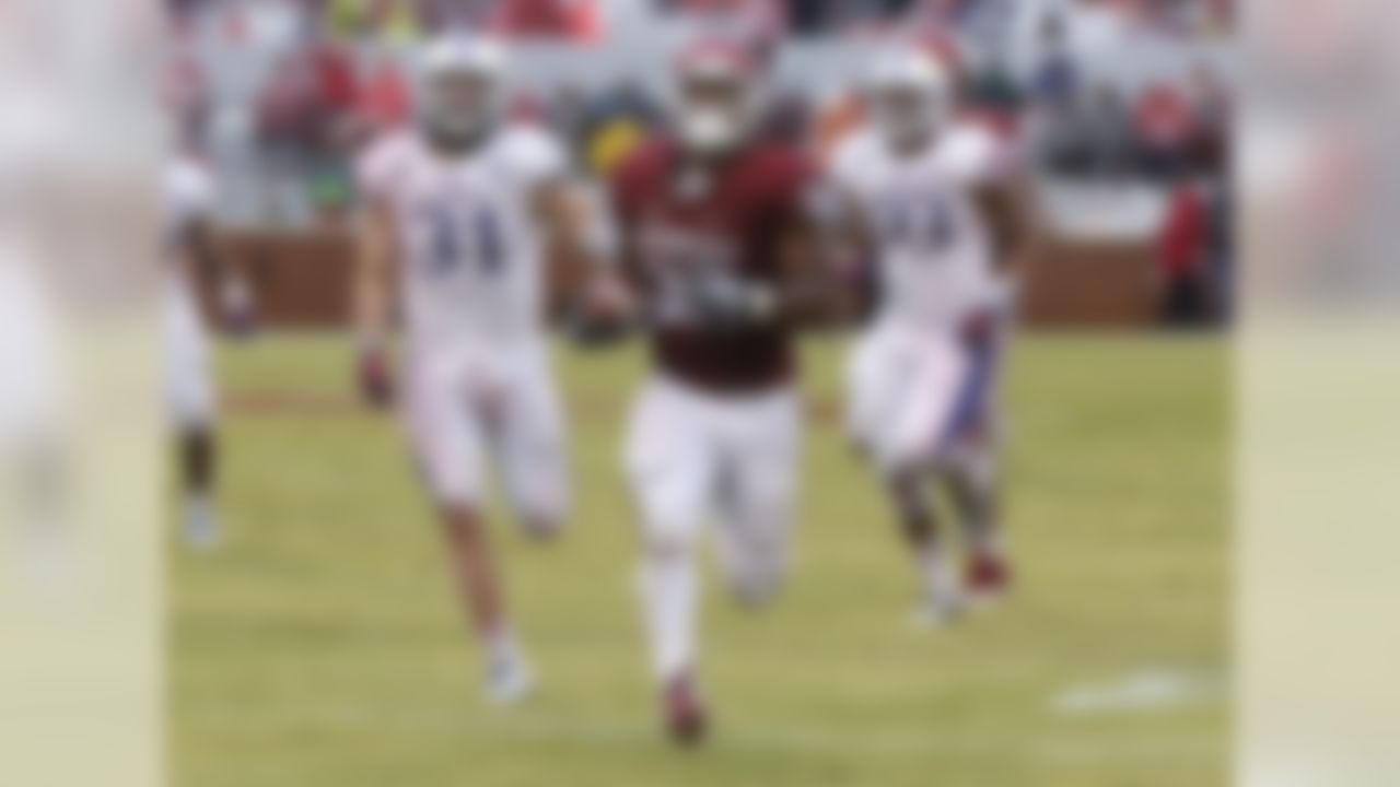 On Nov. 22, 2014, Perine broke Melvin Gordon's week-old record in a 44-7 win over Kansas in rainy Norman, Okla. Perine had five touchdown runs in the win. (AP Photo/Sue Ogrocki)