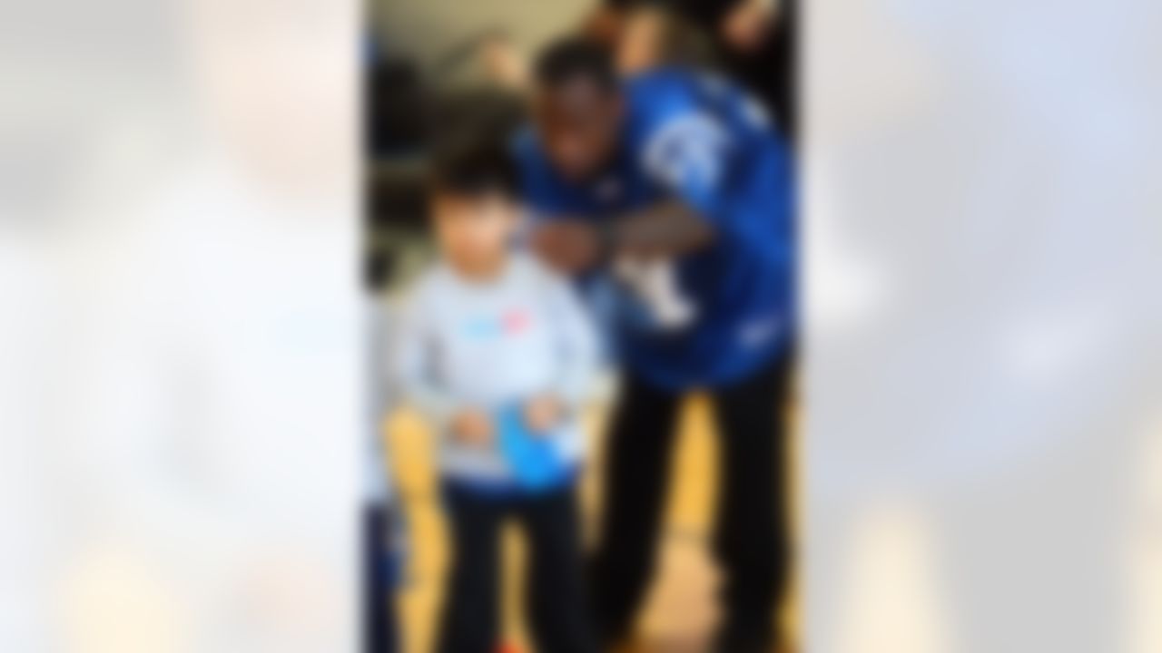 Feb. 02, 2012; Indianapolis, IN, USA; Indianapolis Colts cornerback Brandon King (37) gives instructions to a youngster in the NFL Play 60 event at YET Facility. Mandatory credit: Michael Hickey-US PRESSWIRE