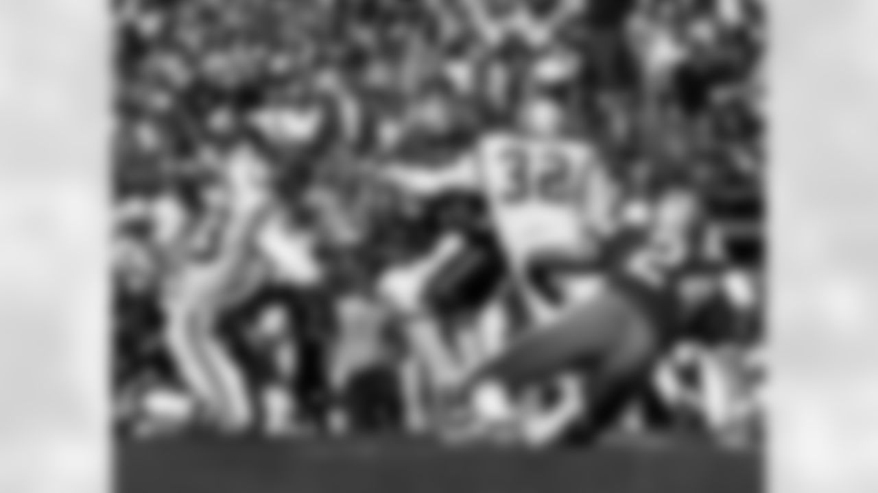 Dallas Cowboys running back Walt Garrison (32) carries the football before being stopped by Colts linebacker Mike Curtis during the Cowboys 16-13 loss to the Baltimore Colts in Super Bowl V on January 17, 1971 at the Orange Bowl in Miami, Florida. (National Football League)