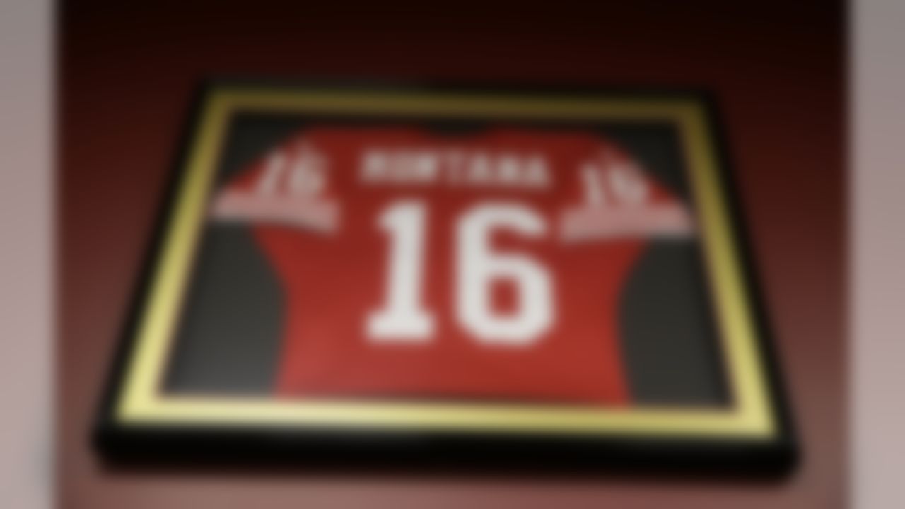 In this photo taken Tuesday, Dec. 17, 2013, the jersey of San Francisco 49ers Hall of Fame quarterback Joe Montana hangs above lockers in the 49ers locker room at Candlestick Park in San Francisco. The San Francisco 49ers are about to play their last NFL football game at the stadium they have called home since 1971. Candlestick Park was also the home of the San Francisco Giants from 1960-1999. (AP Photo/Eric Risberg)