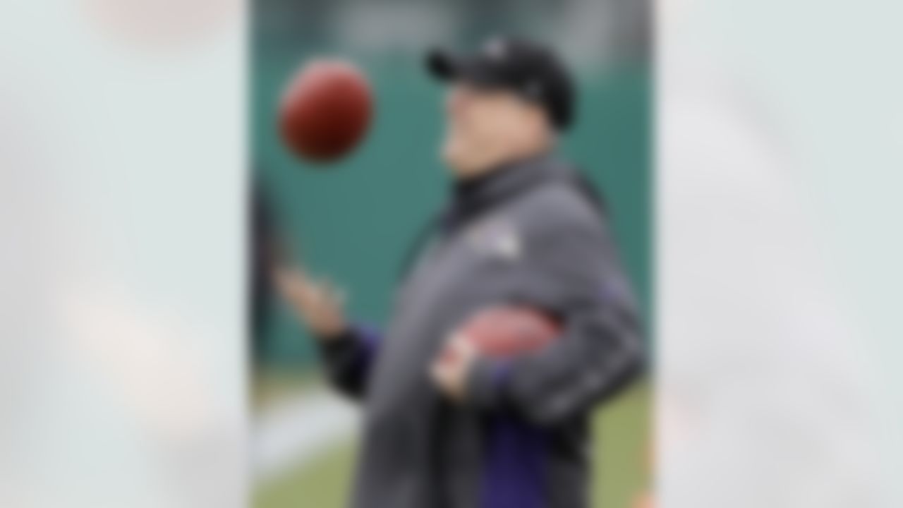 Baltimore Ravens defensive coordinator Dean Pees tosses a football as he watches his players warm up during an NFL Super Bowl XLVII football practice on Wednesday, Jan. 30, 2013, in New Orleans. The Ravens face the San Francisco 49ers in Super Bowl XLVII on Sunday, Feb. 3. (AP Photo/Patrick Semansky)
