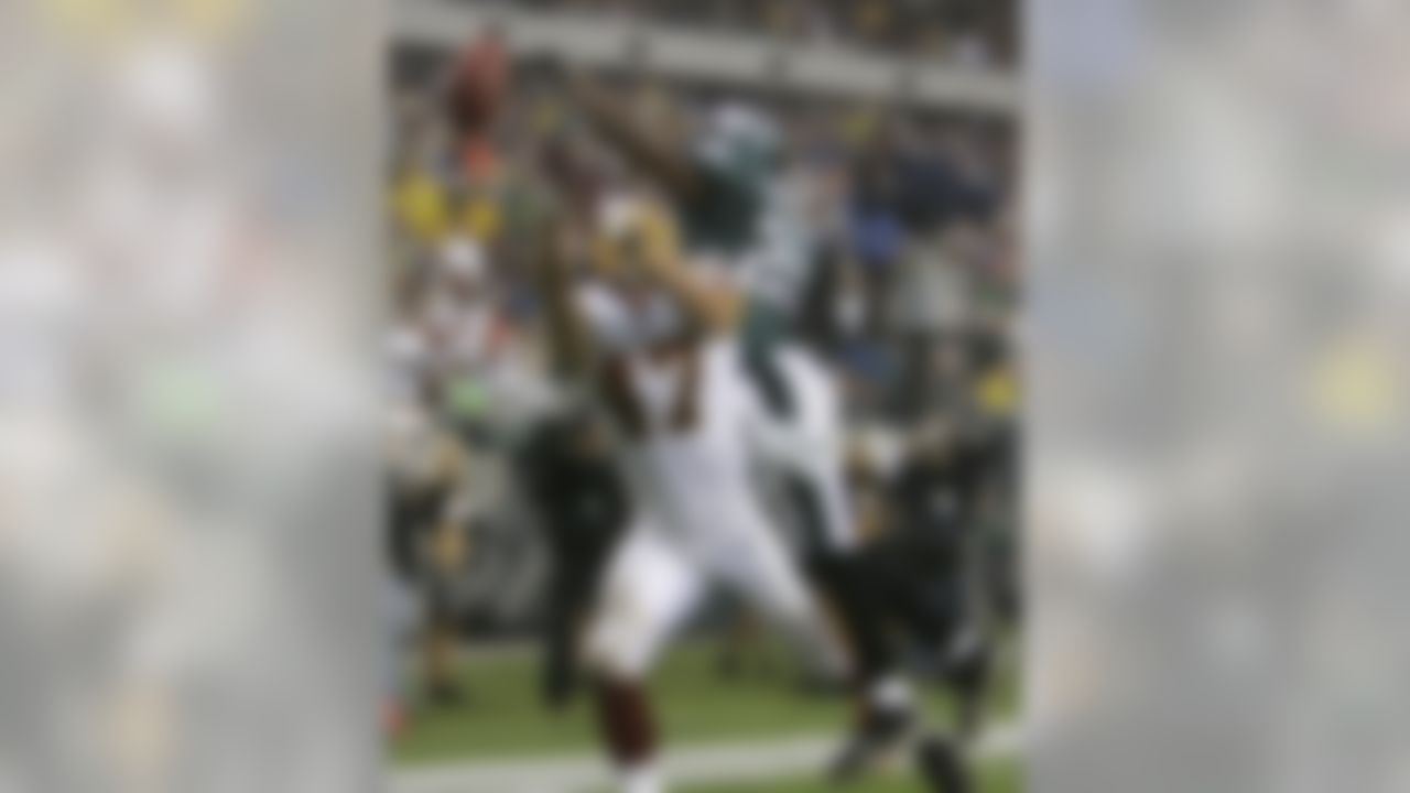 Philadelphia Eagles safety Brian Dawkins, top, breaks up a pass to Washington Redskins end Chris Cooley (47) in the end zone during the second quarter of an NFL football game Sunday, Nov. 12, 2006, in Philadelphia. (AP Photo/George Widman)