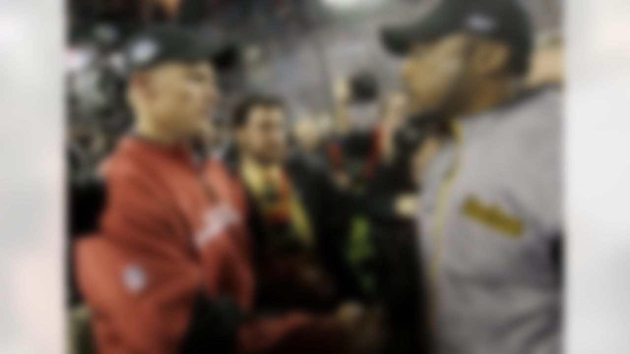 Arizona Cardinals head coach Ken Whisenhunt, left, greets Pittsburgh Steelers head coach Mike Tomlin after Steelers defeated the Cardinals 27-23 to win the NFL Super Bowl XLIII football game, Sunday, Feb. 1, 2009, in Tampa, Fla. (AP Photo/Ross D. Franklin)