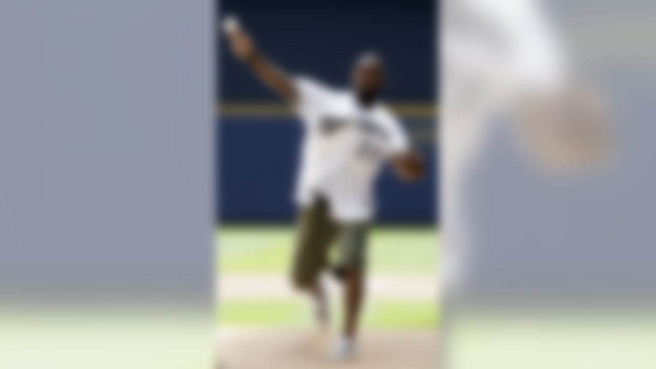 Green Bay Packers' Charles Woodson throws out the ceremonial first pitch before a baseball game between the Milwaukee Brewers and the San Francisco Giants, Wednesday, May 23, 2012, in Milwaukee. (AP Photo/Morry Gash)