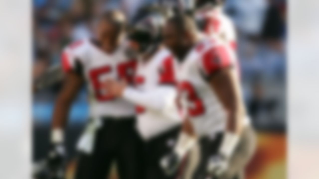 CHARLOTTE, NC - NOVEMBER 11: Teammates Alge Crumpler #83 Morten Anderson #5 and Michael Boley #59 of the Atlanta Falcons celebrate after defeating the Carolina Panthers 20-13 during their game at Bank of America Stadium on November 11, 2007 in Charlotte, North Carolina. (Photo by Streeter Lecka/Getty Images)