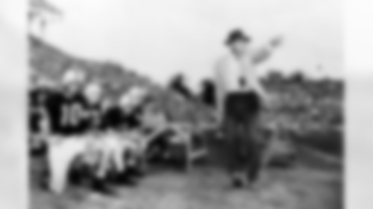 Paul "Bear" Bryant on the sidelines at a college football game in 1957. (Associated Press)
