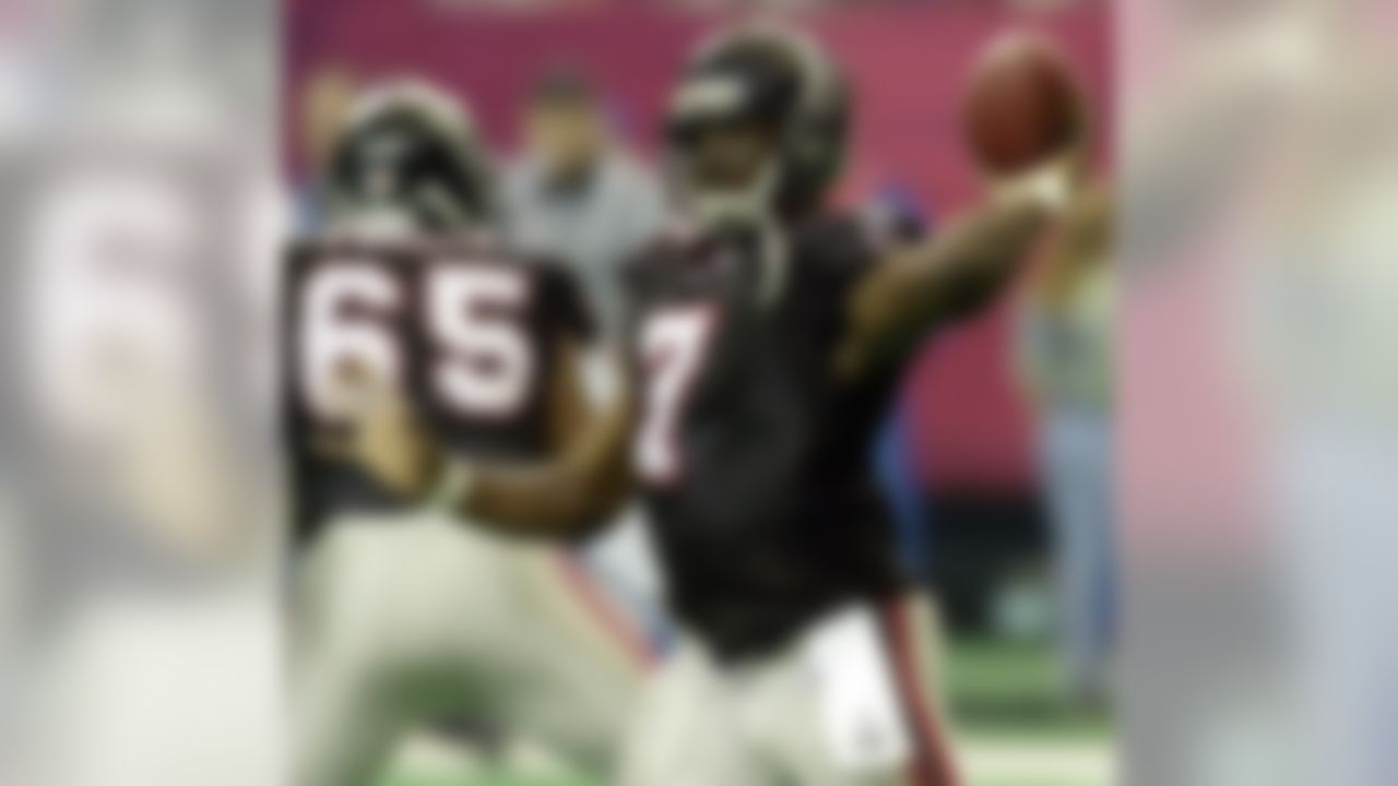 Atlanta Falcons quarterback Michael Vick (7) drops back to pass in the second half of play against the Detroit Lions at the Georgia Dome in Atlanta Sunday, Dec. 22, 2002. Vick was credited with his first 300-plus yard game. (AP Photo/Ric Feld)