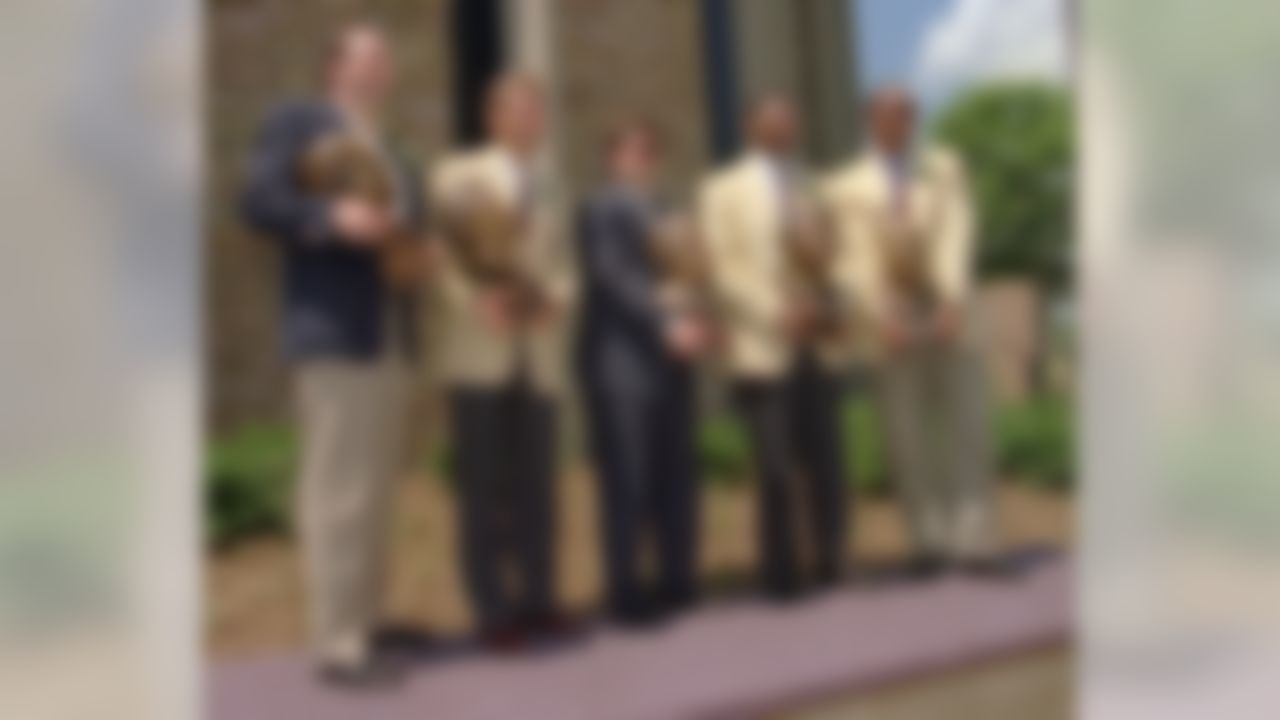 The 1995 Pro Football Hall of Fame enshrinees pose for a photograph after the ceremonies on Saturday, July 29, 1995, in Canton, Ohio. They are, from left to right, Henry Jordan, Jr., Steve Largent, Jim Finks Jr., Lee Roy Selmon and Kellen Winslow. Jordan and Finks were accepting for their fathers. (AP Photo/Mark Duncan)