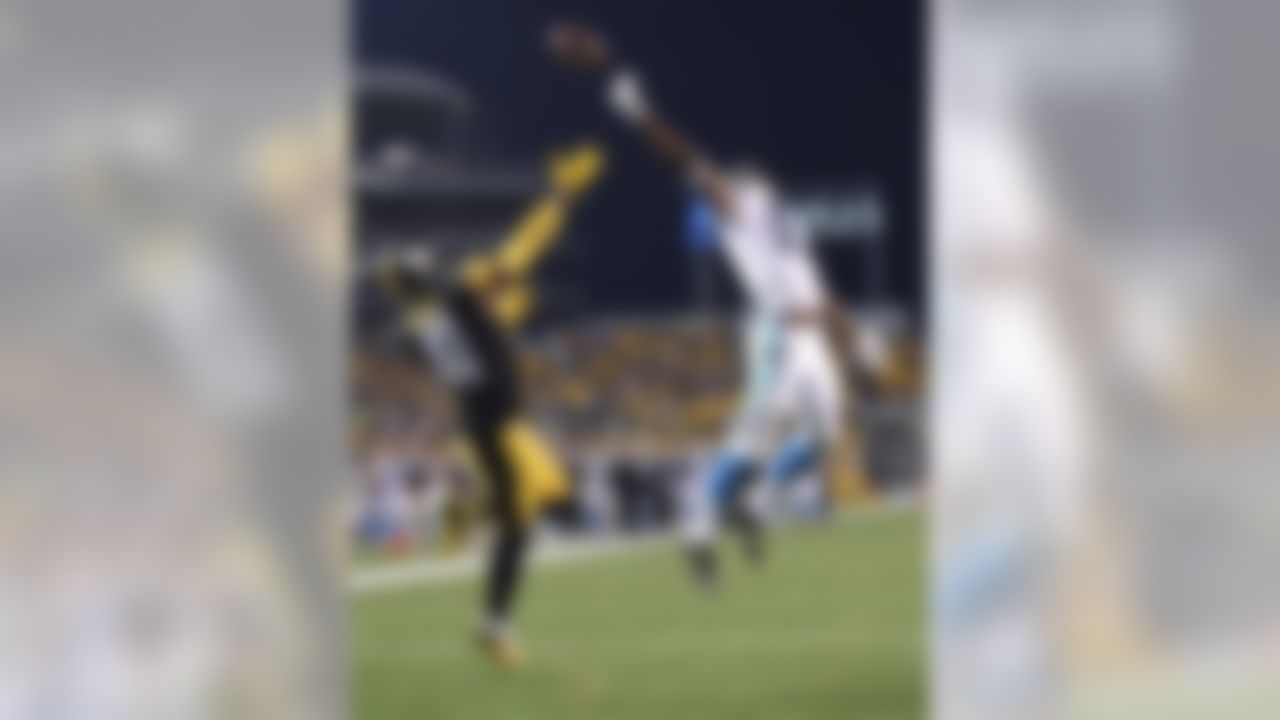 Carolina Panthers wide receiver Devin Funchess (17) can't reach a pass that goes over him and Pittsburgh Steelers defensive back Antwon Blake (41) during the second quarter of an NFL preseason football game, Thursday, Sept. 3, 2015, in Pittsburgh.