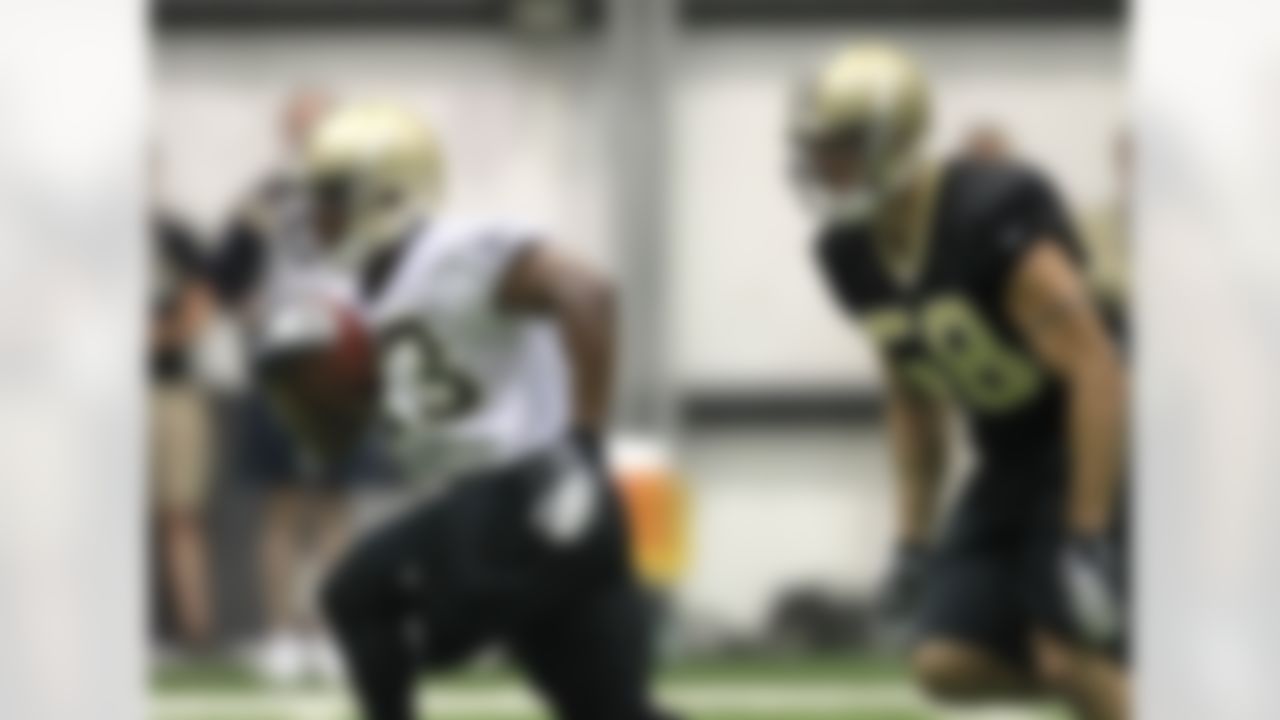 New Orleans Saints running back Darren Sproles (43) runs past outside linebacker Scott Shanle (58) during NFL football training camp in Metairie, La., Friday, July 27, 2012. (AP Photo/Gerald Herbert)
