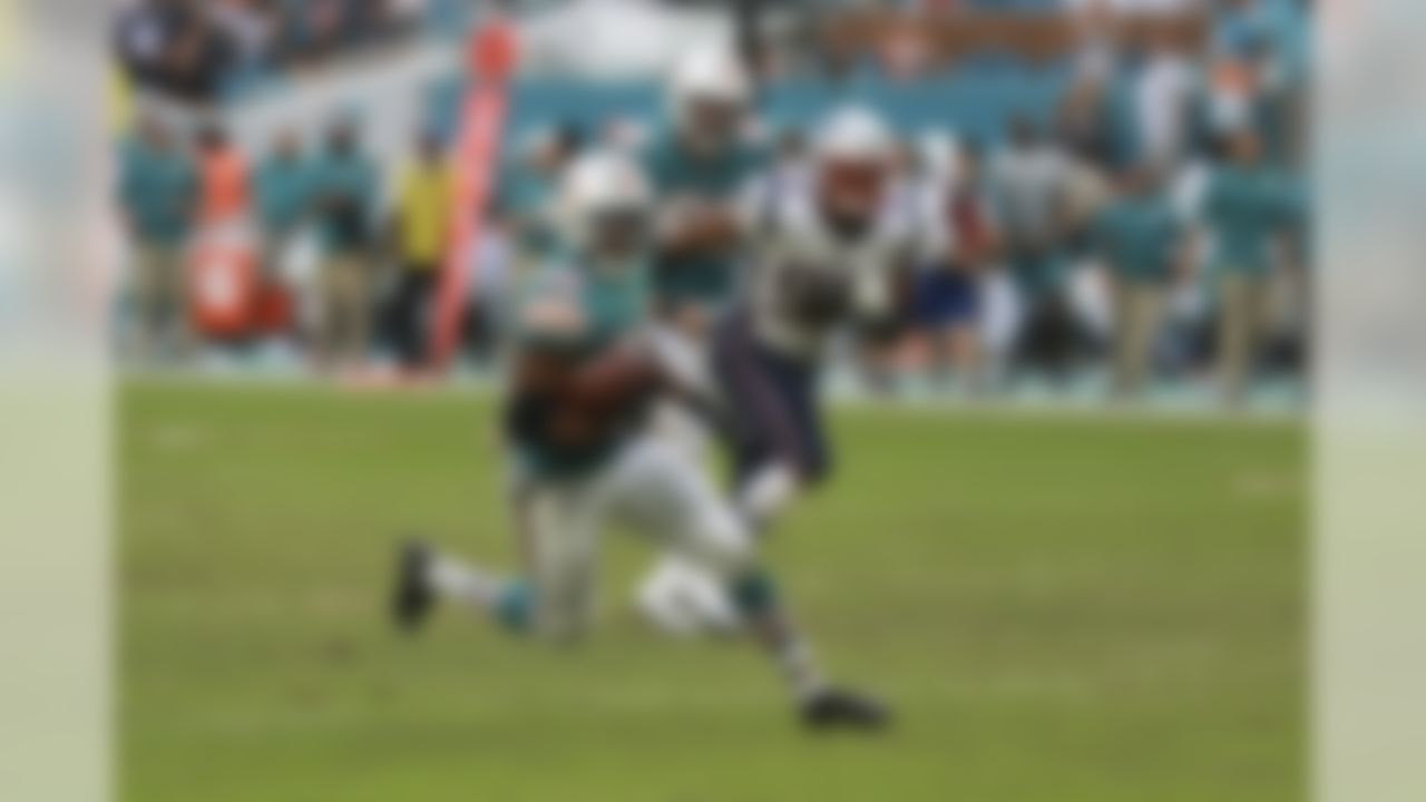 Miami Dolphins running back Kenyan Drake (32) runs for a touchdown during a NFL football game against New England Patriots, Sunday, Dec. 9, 2018, in Miami Gardens, FL.