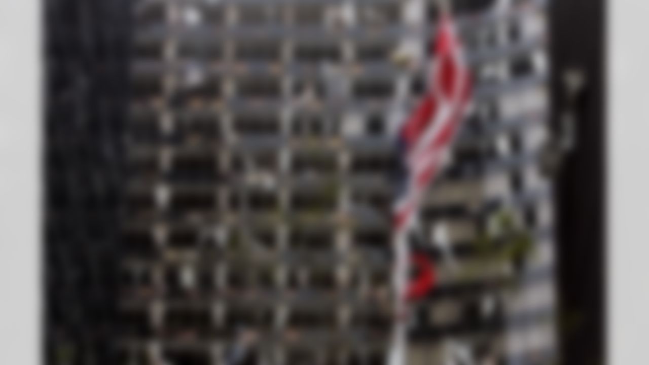 A tattered American flag flies in front of the blown-out Hyatt Hotel in New Orleans on Monday, Aug. 29, 2005. (AP Photo/Bill Haber)
