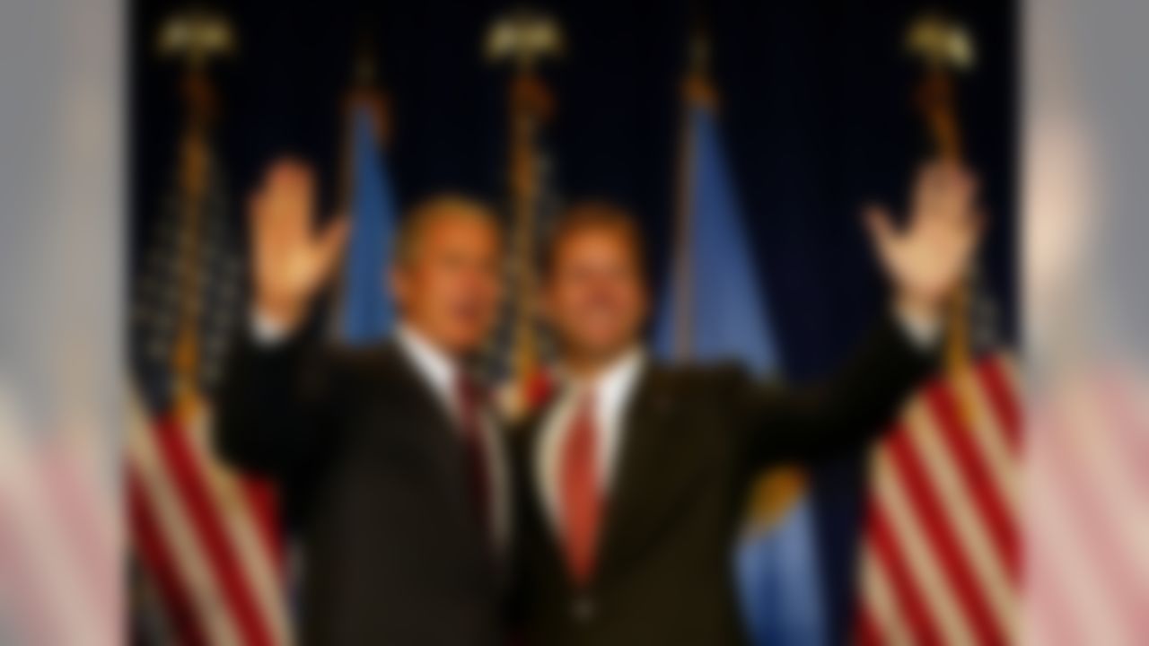 President George Bush and former congressman Steve Largent wave during a Steve Largent for Governor and James Inhofe for Senate Luncheon on Thursday, Aug. 29, 2002, in Oklahoma City, Okla. (AP Photo/Rick Bowmer)