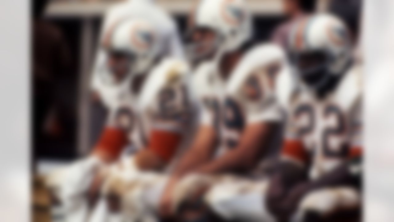 Miami Dolphins running backs Jim Kiick (21), Larry Csonka (39) and Mercury Morris (22) watch from the sidelines during the AFC Championship Game against the Pittsburgh Steelers in Pittsburgh, Penn., Dec. 31, 1972. The Dolphins defeated the Steelers 21-17. (AP Photo/Tony Tomsic)