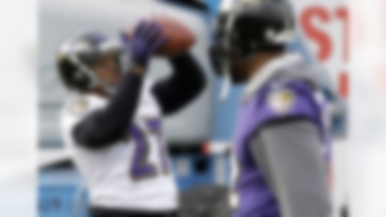 Baltimore Ravens running back Ray Rice, left, catches a pass as linebacker Ray Lewis walks past during an NFL Super Bowl XLVII football practice on Wednesday, Jan. 30, 2013, in New Orleans. The Ravens face the San Francisco 49ers in Super Bowl XLVII on Sunday, Feb. 3. (AP Photo/Patrick Semansky)