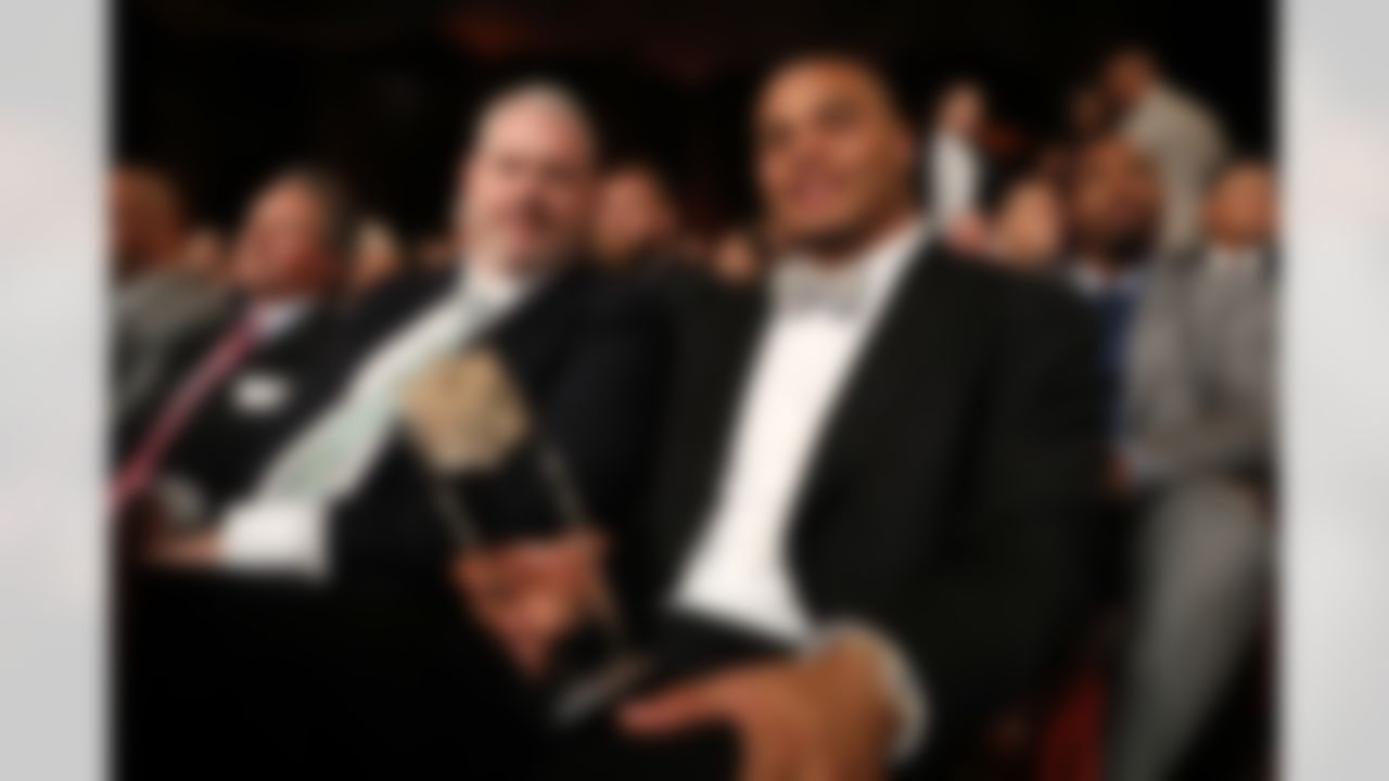 Dallas Cowboys quarterback Dak Prescott poses with the 2016 Associated Press NFL Offensive Rookie of the Year award during the 6th annual NFL Honors award show at the Wortham Theater Center on Saturday, Feb. 4, 2017 in Houston. (Todd Rosenberg/NFL)