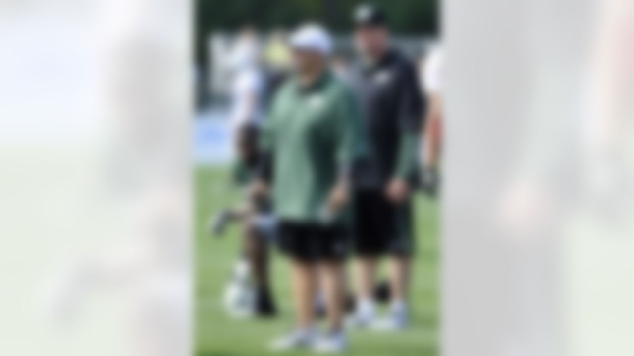 New York Jets offensive coordinator Tony Sparano, front left, and coach Rex Ryan watch practice at NFL football training camp on Sunday, July 29, 2012, in Cortland, N.Y. (AP Photo/Bill Kostroun)